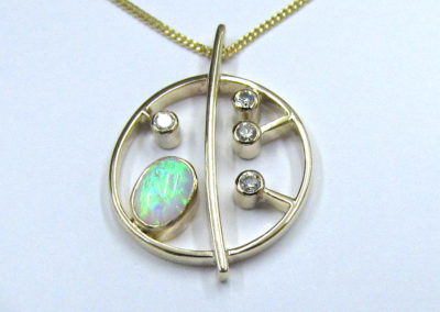 Yellow gold diamond and opal honesty pendant and earrings
