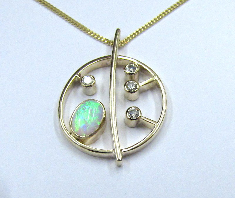 Yellow gold diamond and opal honesty pendant and earrings
