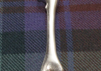 Thigh bone kilt pin