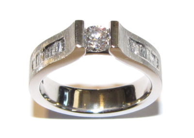 engagement ring with channel set shoulders